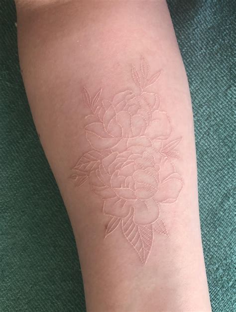 aged badly white ink tattoo